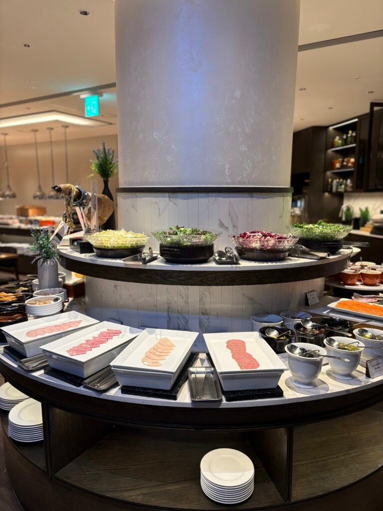 Breakfast buffet with fruit, cold dishes and hot food at AC Kitchen