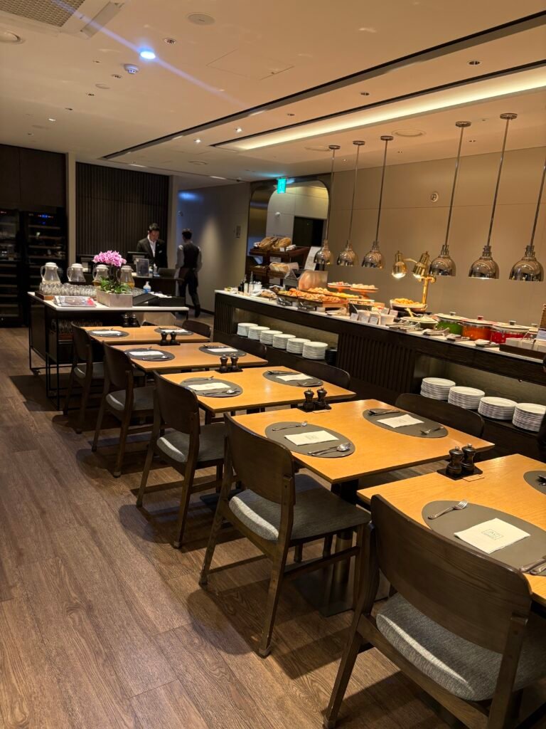 Dining room and buffet counters inside AC Kitchen at AC Hotel Seoul Gangnam