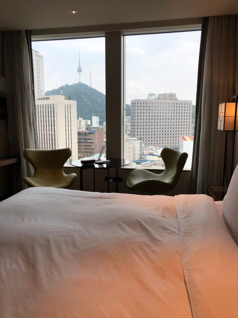 Premier King Room with N Seoul Tower visible through the window at Courtyard Seoul Namdaemun