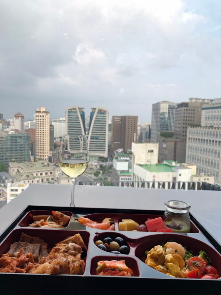 Plated Executive Lounge happy-hour meal with city view in 2020