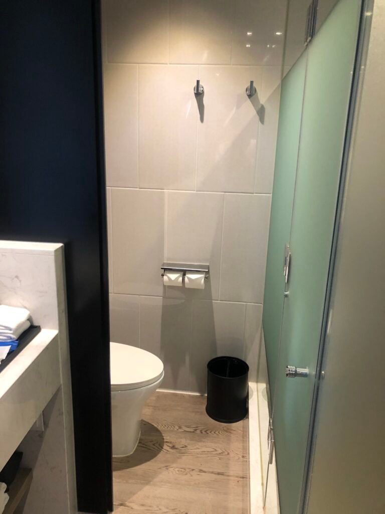 Open bathroom layout with glass-enclosed toilet at Fairfield by Marriott Seoul