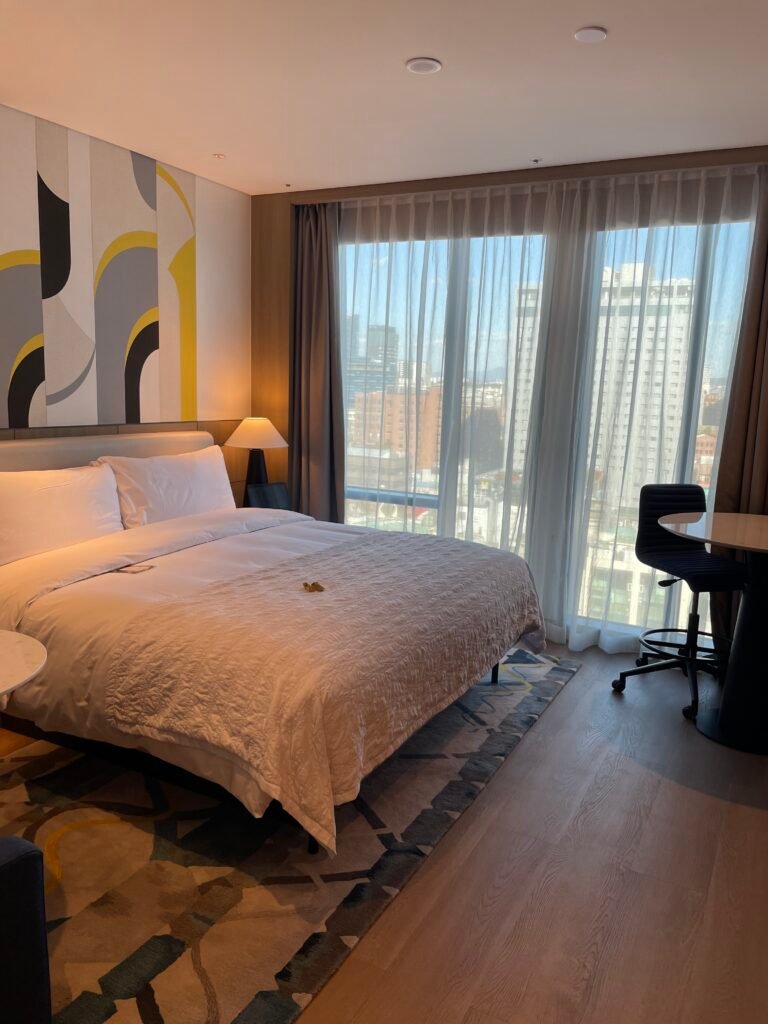 Deluxe King Room at Le Méridien Seoul Myeongdong with king bed and floor-to-ceiling window