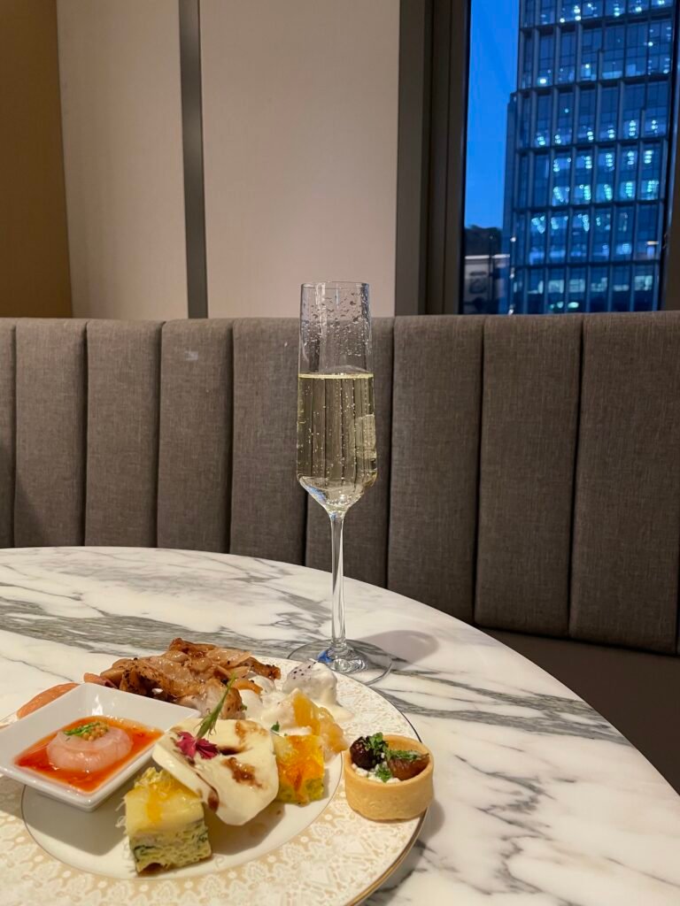 Happy-hour plate and glass of sparkling wine in the Club Lounge at Le Méridien Seoul Myeongdong