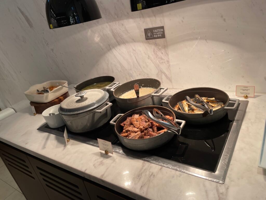 Grilled mackerel, pork and other hot breakfast dishes in the Club Lounge