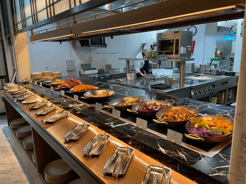 Hot breakfast buffet and open kitchen at La Palette Paris