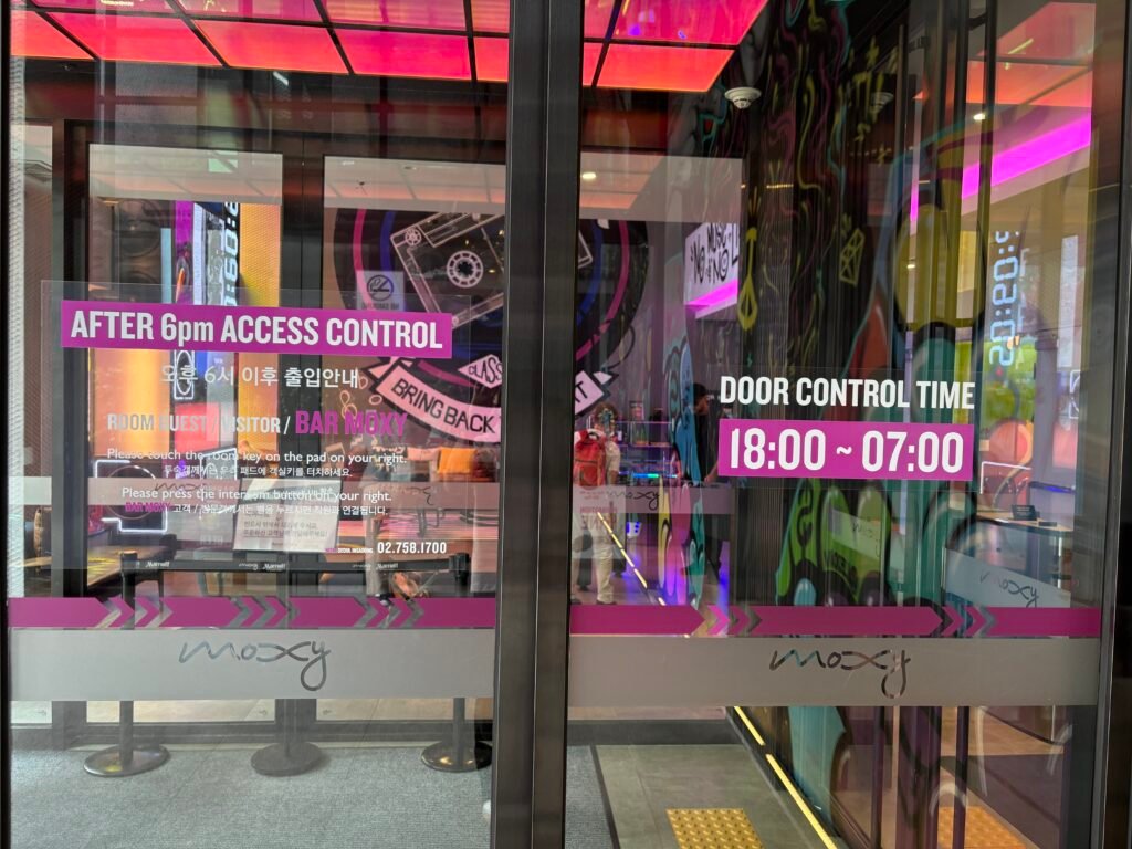 Evening access-control notice at the entrance of Moxy Seoul Insadong