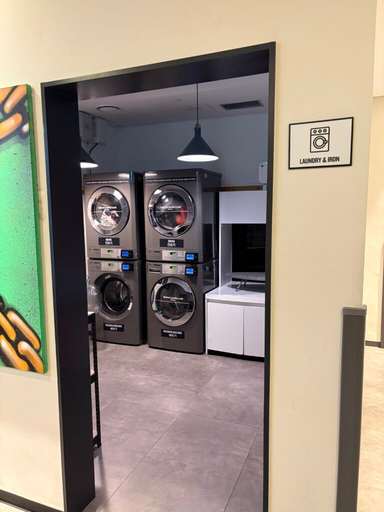 Self-service washing machines and dryers at Moxy Seoul Insadong