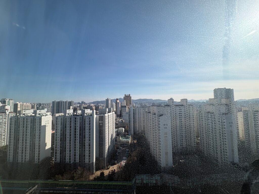 Railway and apartment view from a high-floor room at The Link Seoul