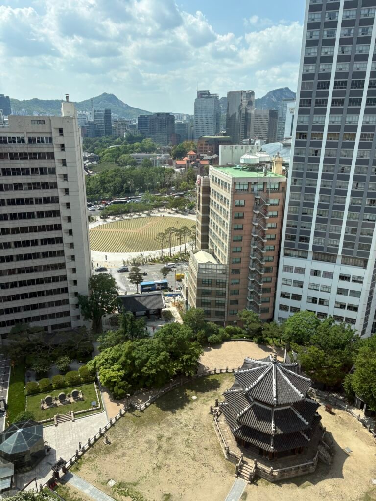 Hwangudan historic altar and central Seoul buildings viewed from the executive lounge