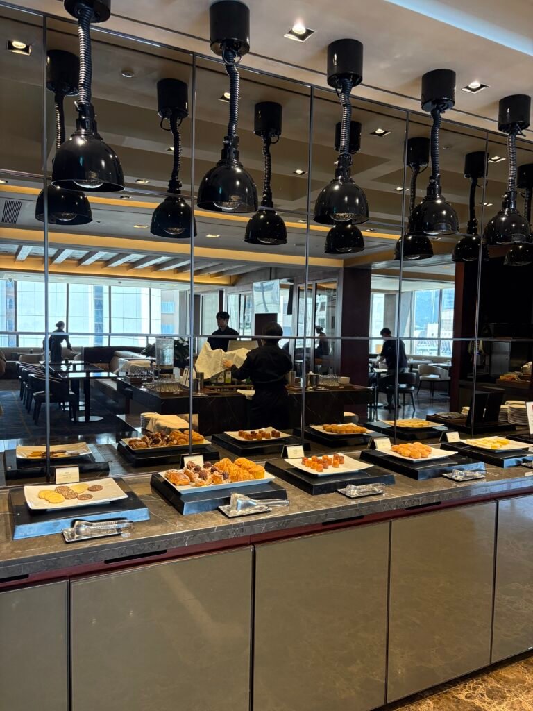Bread, pastries, and snacks arranged at the executive lounge buffet