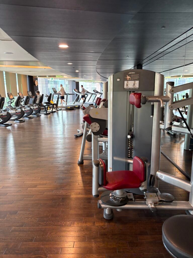 Spacious fitness center with cardio and strength-training equipment