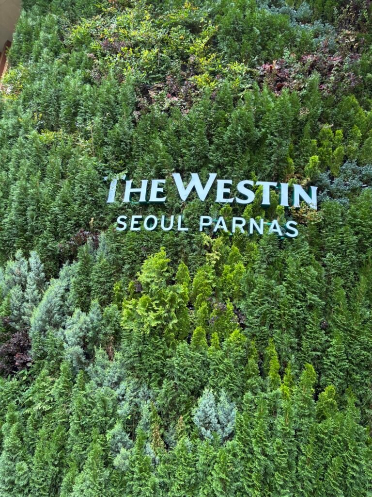 The Westin Seoul Parnas hotel sign near the entrance in Gangnam