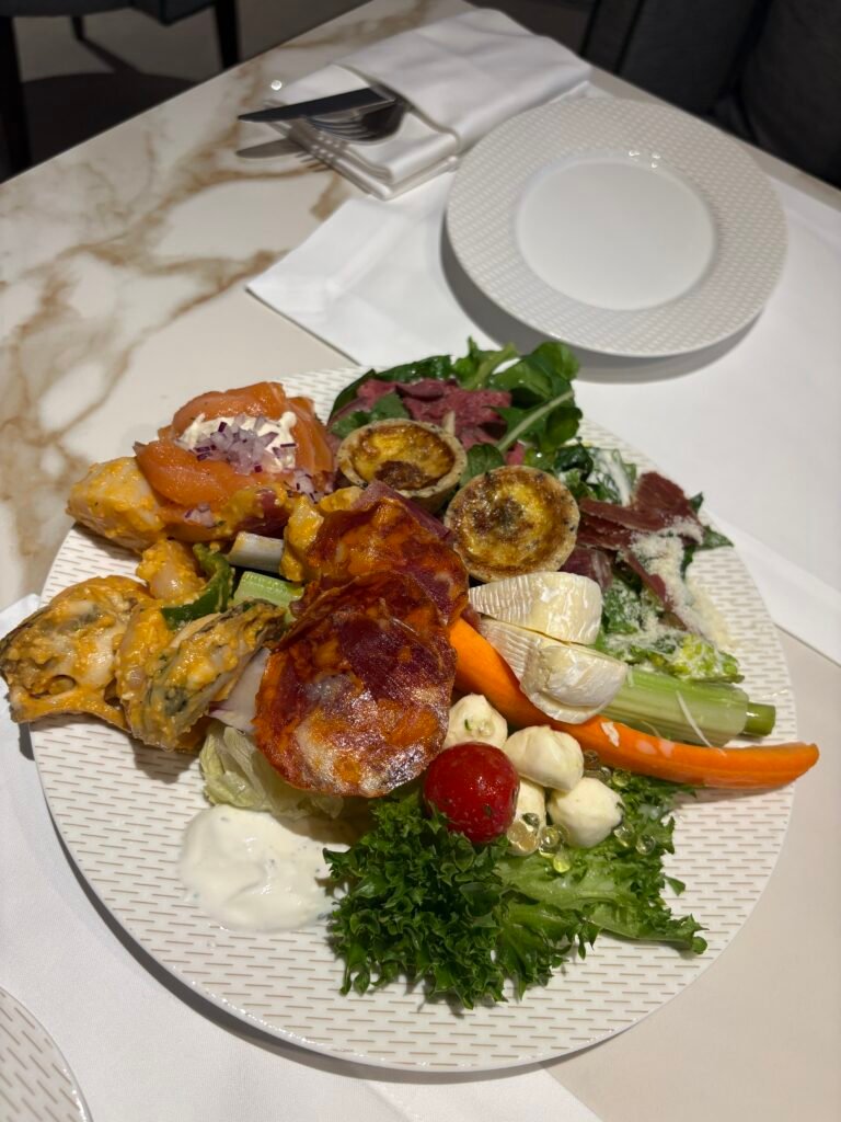 Plate of lamb chops and other evening cocktail dishes in the Westin Club lounge