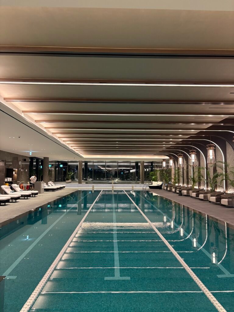 Three-lane indoor swimming pool viewed from the end of the pool at The Westin Seoul Parnas