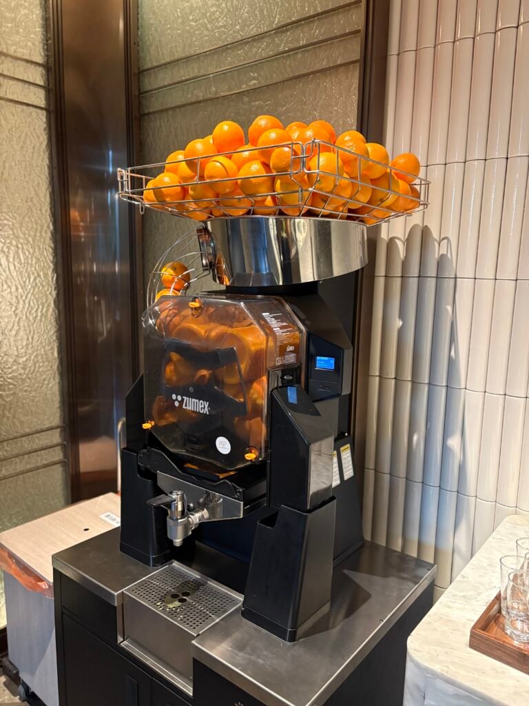 Fresh orange juice machine at On Table breakfast
