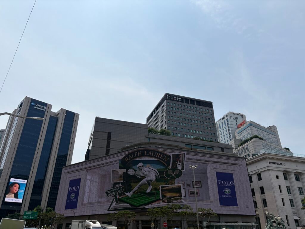 Current Shinsegae Department Store digital façade seen in daylight in 2026
