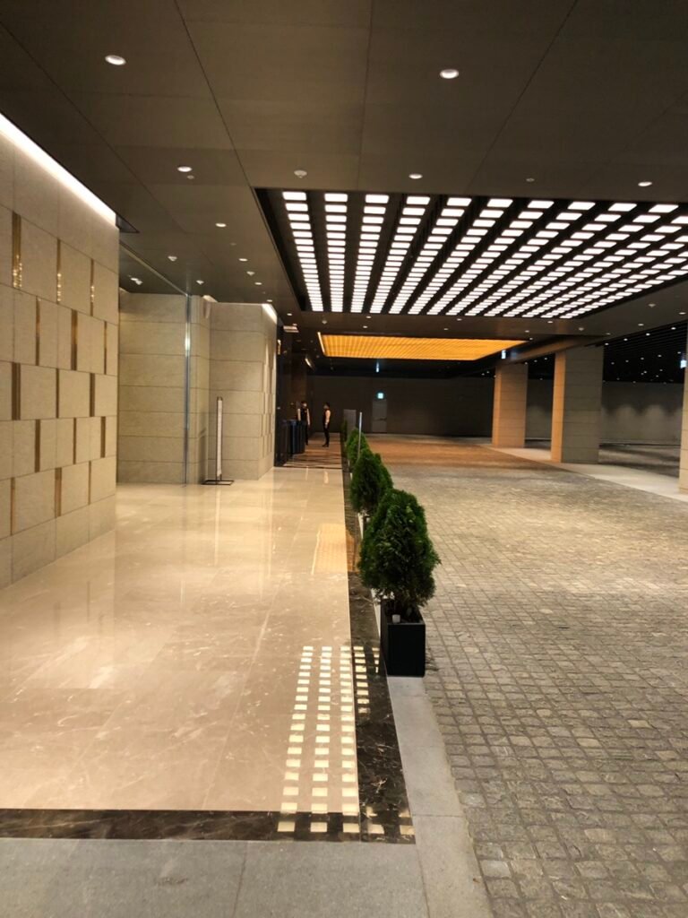 Lower-level arrival corridor inside Centerfield leading toward Josun Palace