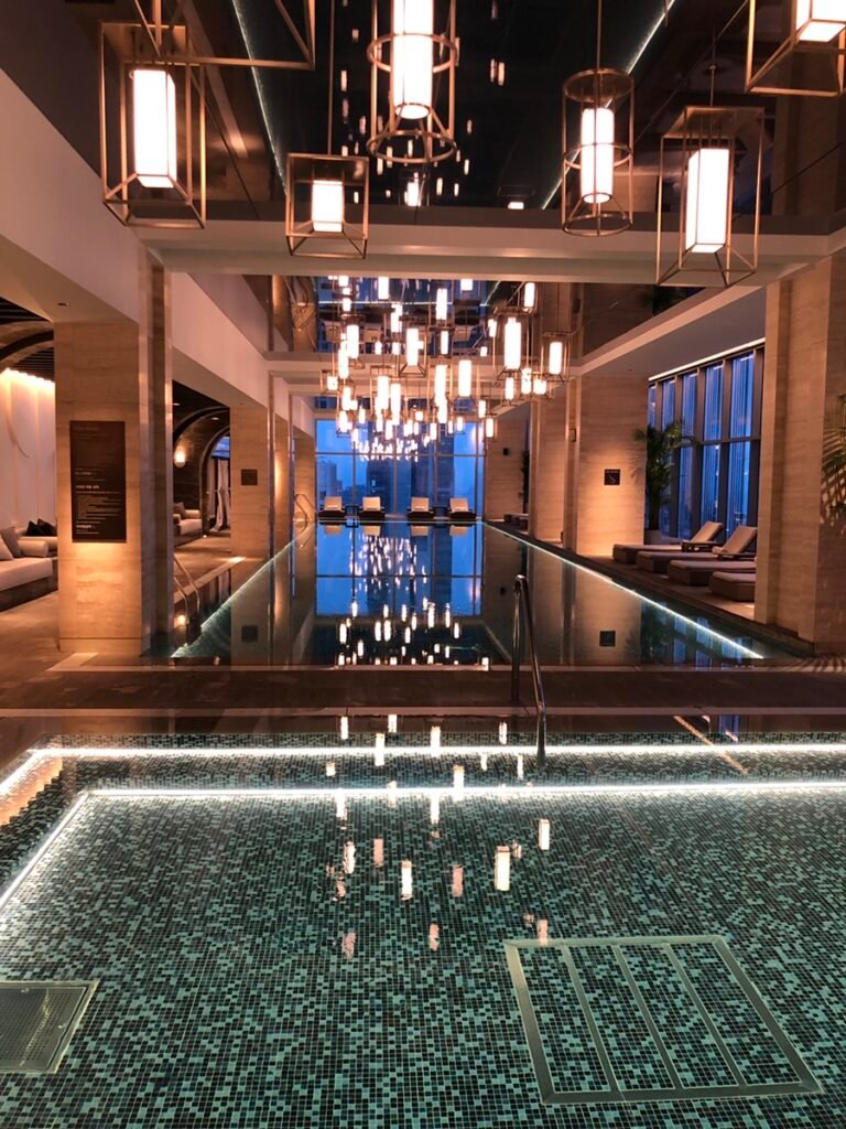 Indoor swimming pool with reflective ceiling at Josun Palace Seoul