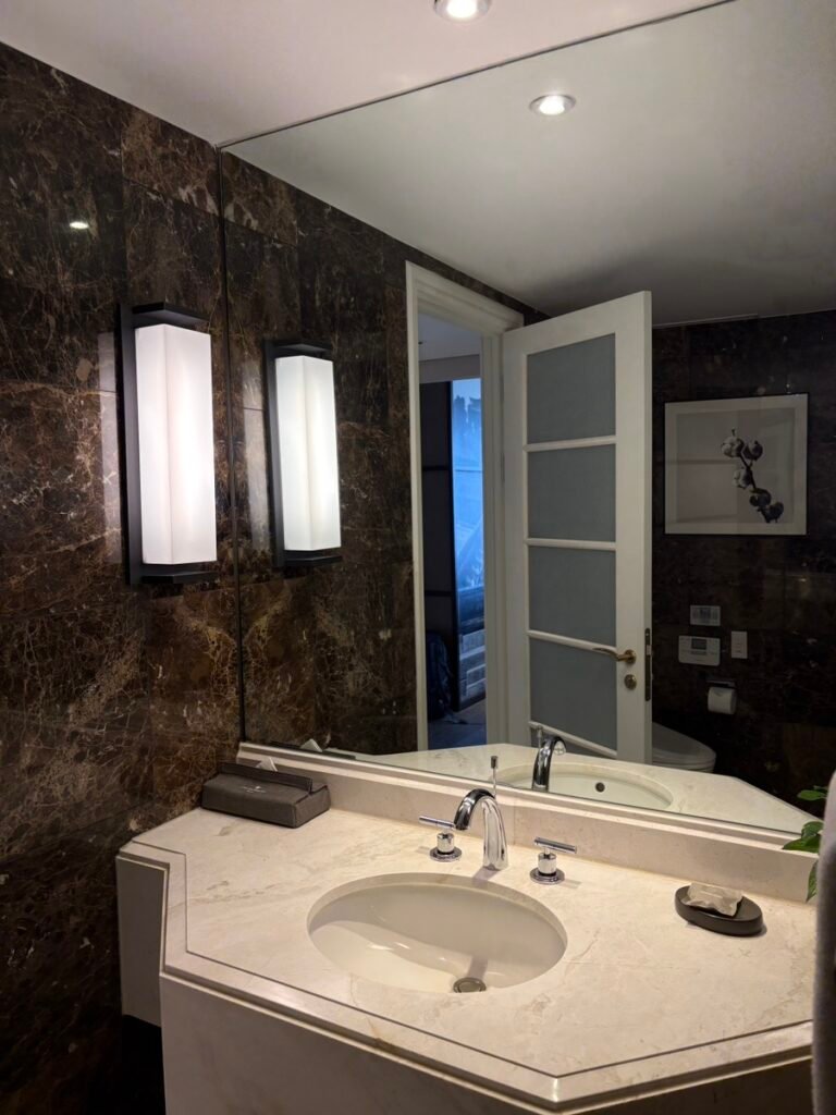 Marble bathroom with double sinks in a Griffin Suite at JW Marriott Seoul