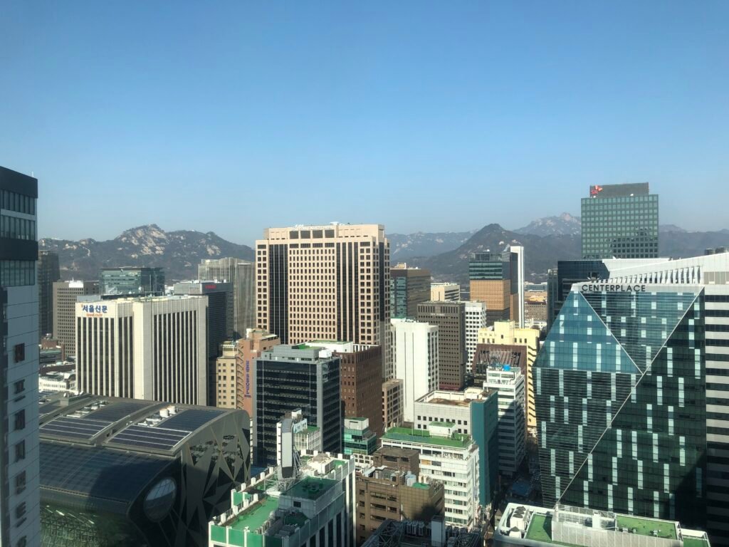 Daytime city and Bugaksan view from the Main Tower at Lotte Hotel Seoul