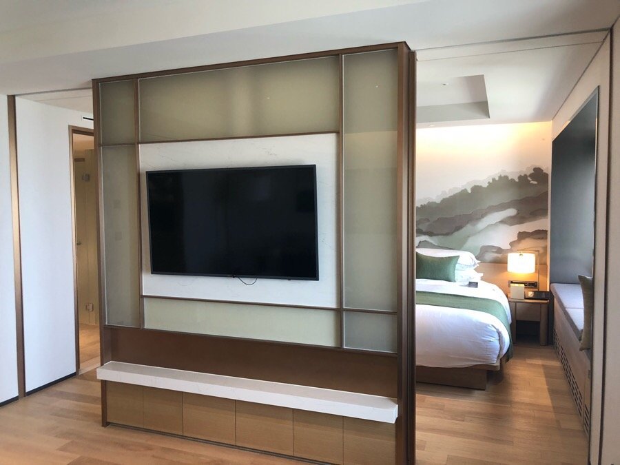 Separate bedroom and living room layout in a Grand Walkerhill Seoul Club Suite