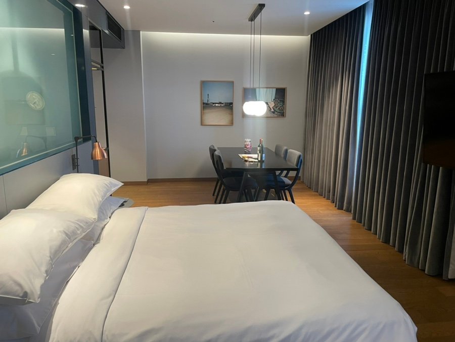 Producer Suite bedroom and dining area at RYSE Autograph Collection Seoul