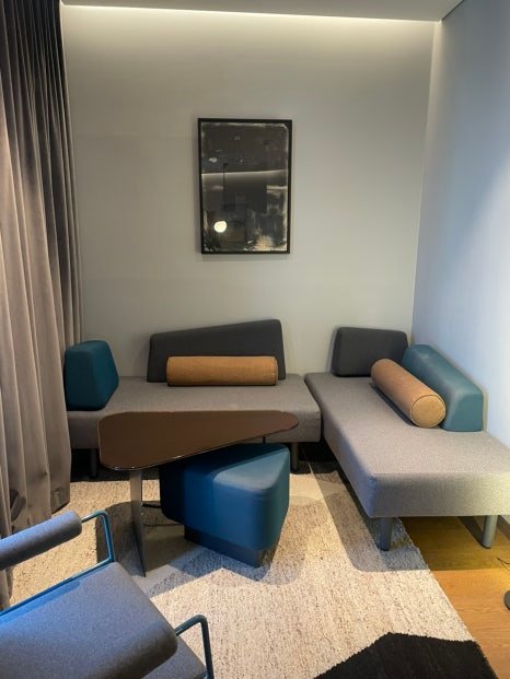 Living area and custom sofa in a Producer Suite at RYSE Seoul